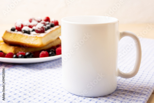 White coffee mug mockup with waffles and berries