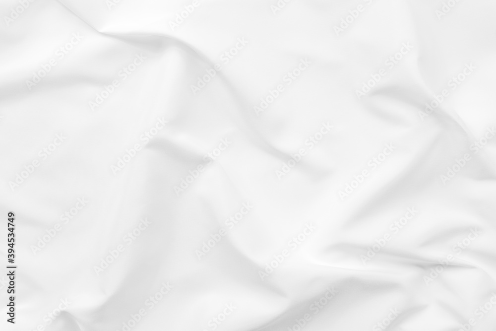 Abstract white fabric texture background. Cloth soft wave. Creases of satin. silk and cotton.