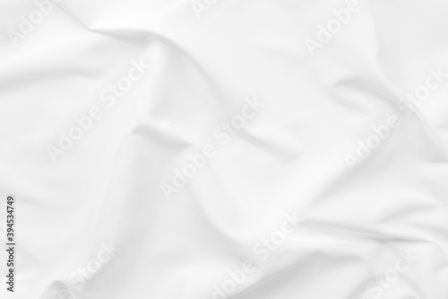 Abstract white fabric texture background. Cloth soft wave. Creases of satin. silk and cotton.