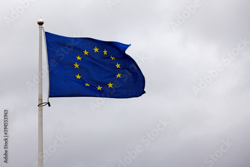eu flag with disturbing gray sky