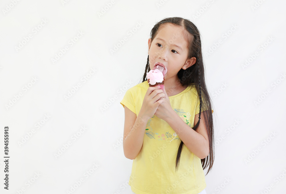 Portrait asian little child girl eating ice cream cone isolated on white background. Portrait asian little child girl eating ice cream cone isolated on white background.