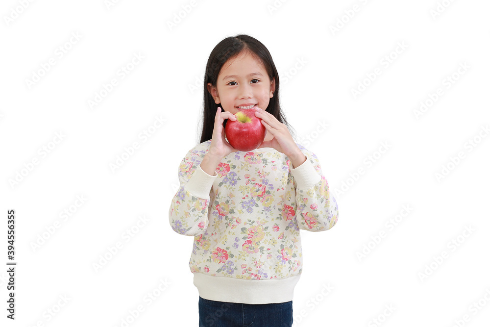 Little asian girl eating red apple over white background Little asian girl eating red apple over white background
