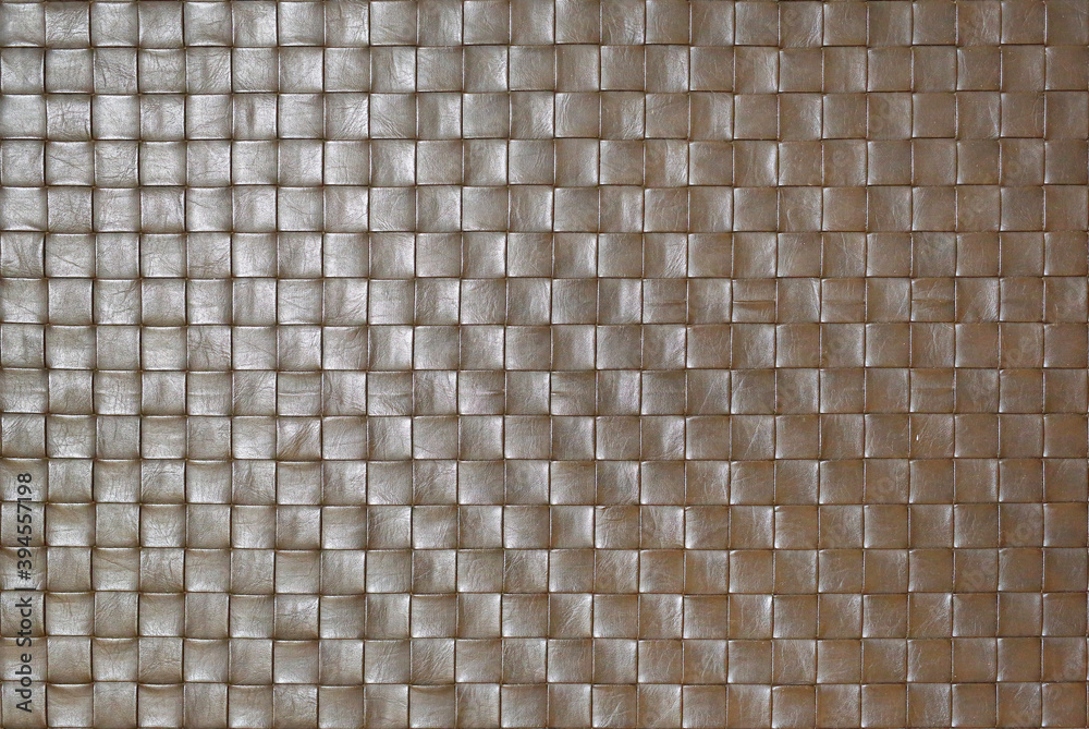 Braided or woven texture of brown leather background. Braided or woven texture of brown leather background.