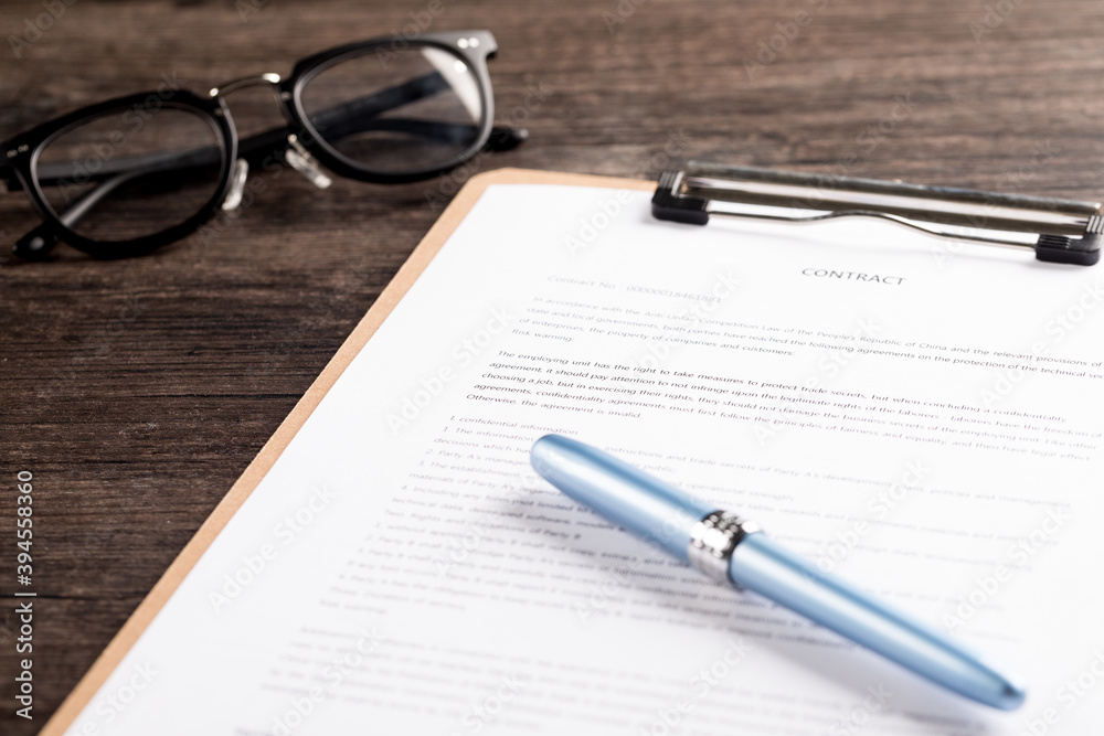 Business people signing a contract Business people signing a contract