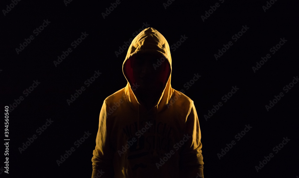 mysterious character on dark background mysterious character on dark background