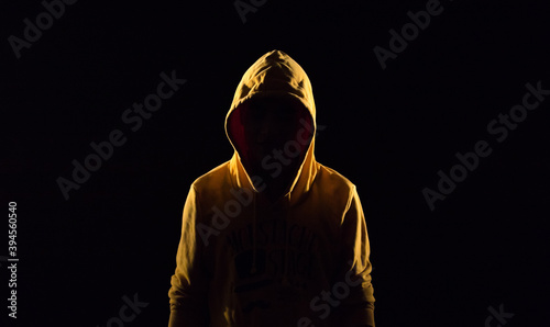 mysterious character on dark background