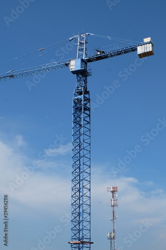 A large blue crane in the urban building construction area  © Weerayuth