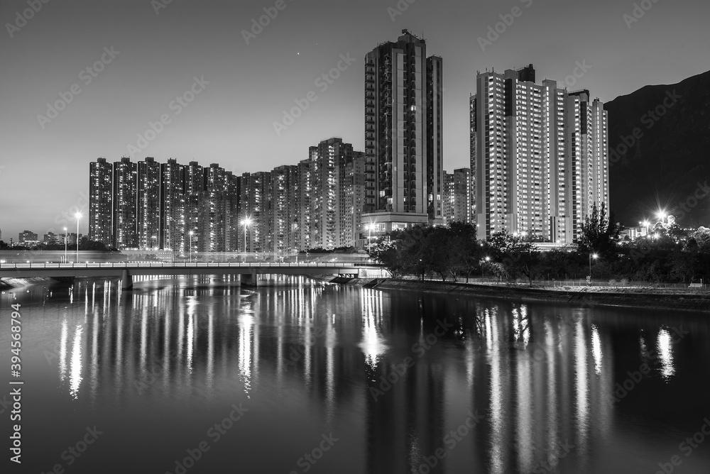 High rise residential building and mountain in Hong Kong city at night