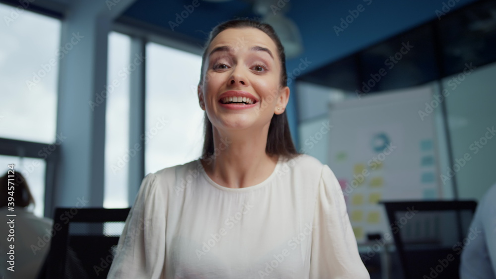 Businesswoman video chatting online. Female professional waving hand at camera Businesswoman video chatting online. Female professional waving hand at camera