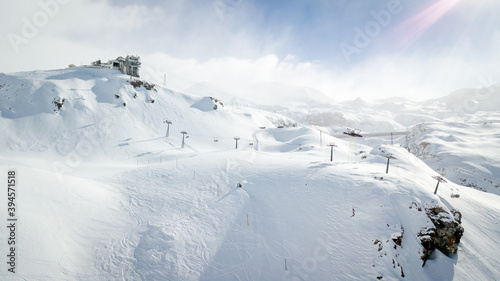 Panorama of Cervinia Cervinia ski resort, Italy. Beautiful landscape in the Alps. Ski chair lifts with skiers photo