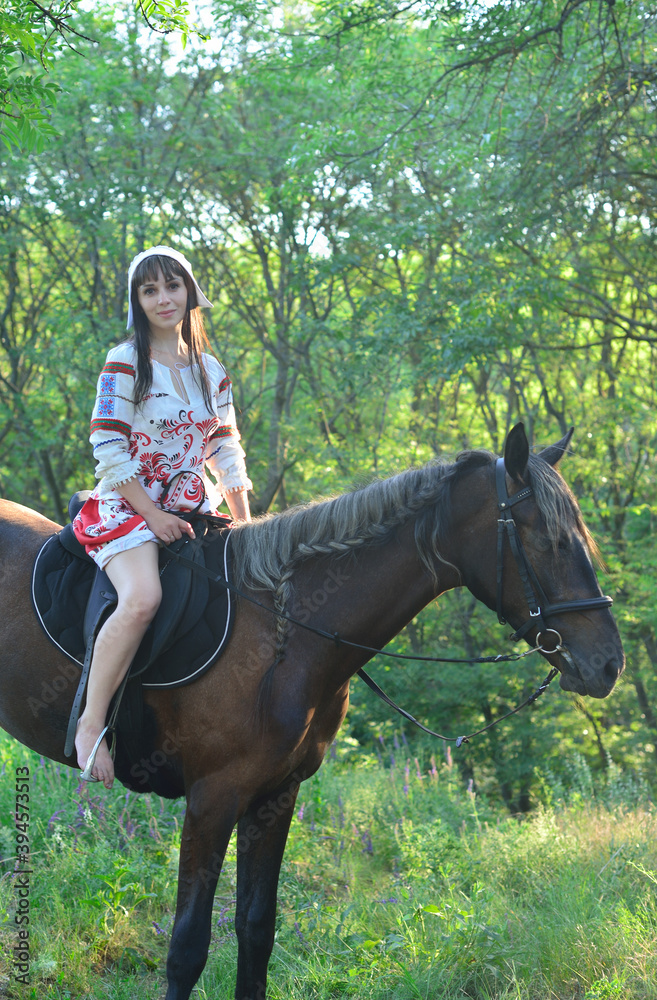 Girl in an ancient russian attire riding a horse Girl in an ancient russian attire riding a horse