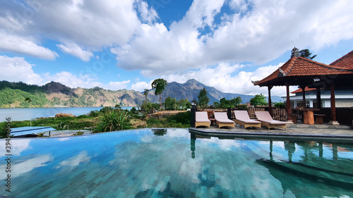 Luxury swimming pool with mountain background © Creativa Images