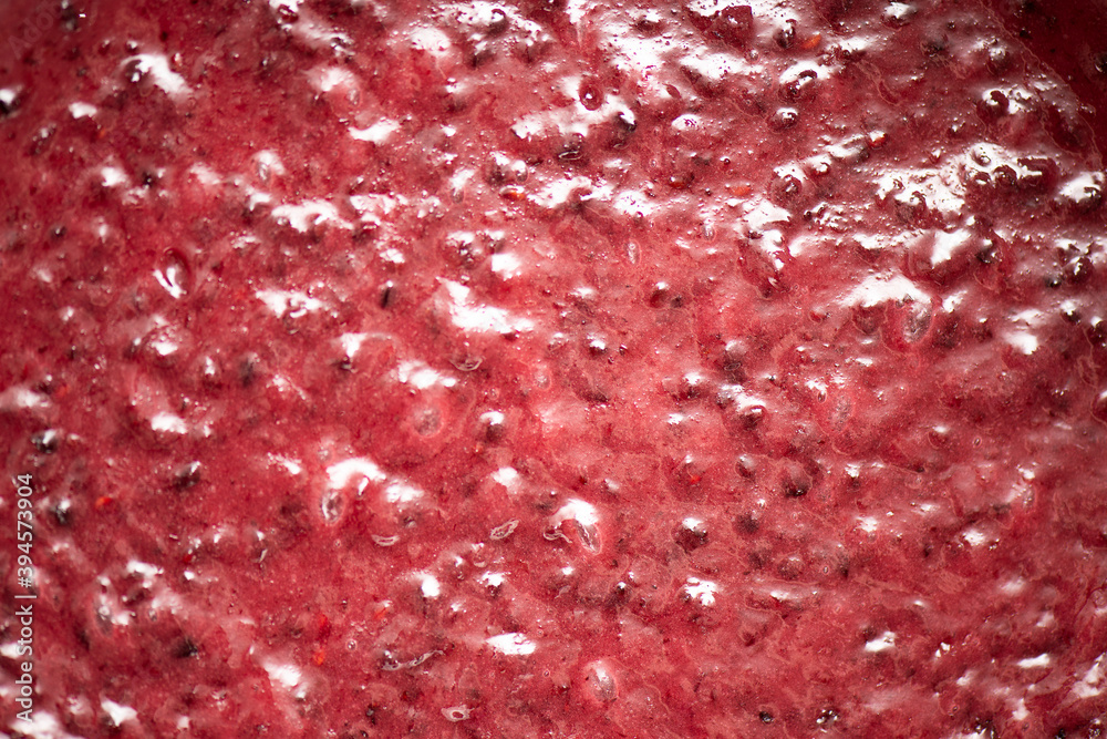 Detailed closeup of berry icing for a cake, food background.