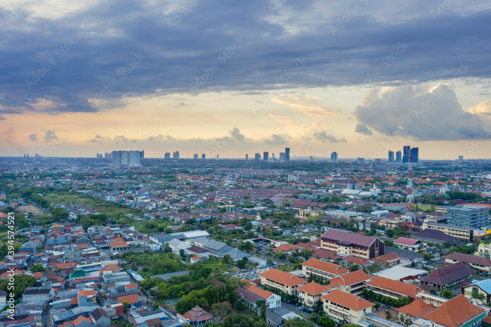 Beautiful cloudy sky above dense housing in Jakarta