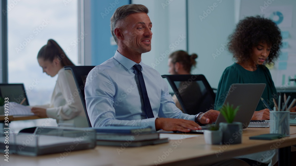 Obraz premium Businessman waving hand on laptop camera. Worker having video call on laptop