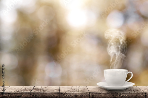a hot coffee on the table on a spring background