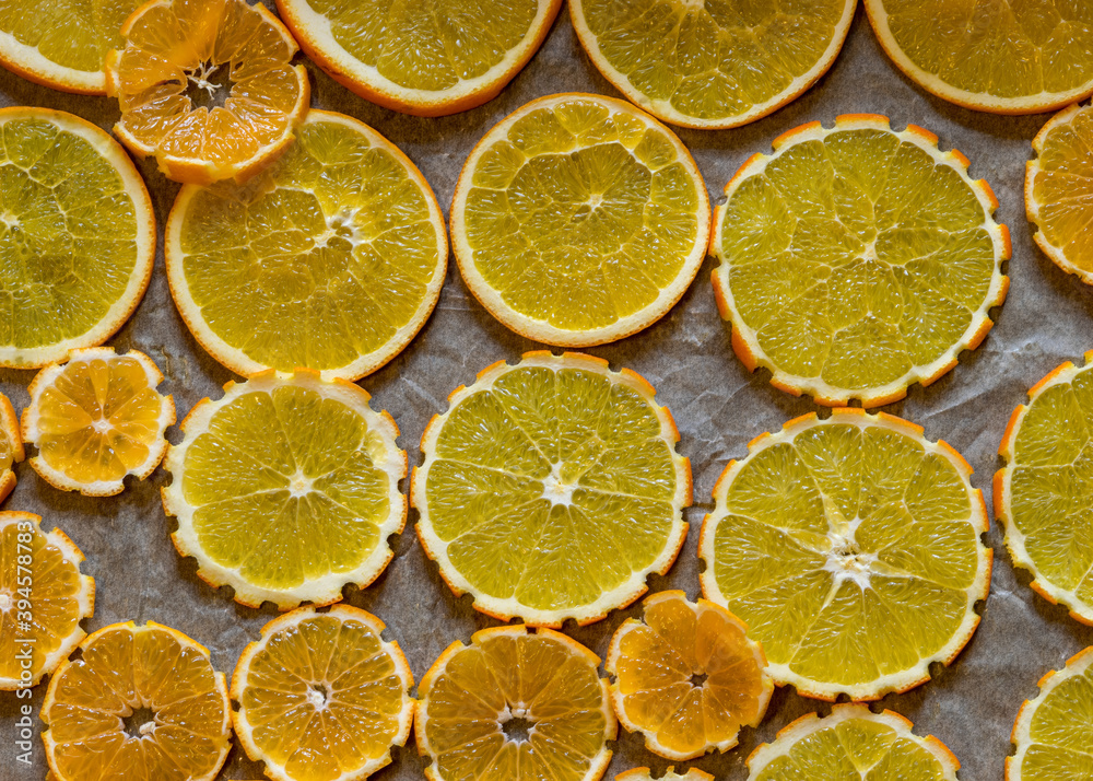 sliced orange slices on a metal pan preparing for drying, preparing for Christmas, waiting for Christmas and home decorating concept sliced orange slices on a metal pan preparing for drying, preparing for Christmas, waiting for Christmas and home decorating concept