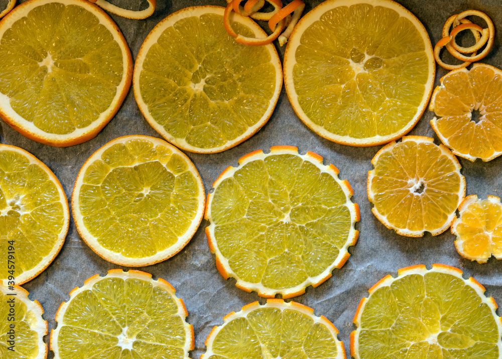sliced orange slices on a metal pan preparing for drying, preparing for Christmas, waiting for Christmas and home decorating concept sliced orange slices on a metal pan preparing for drying, preparing for Christmas, waiting for Christmas and home decorating concept