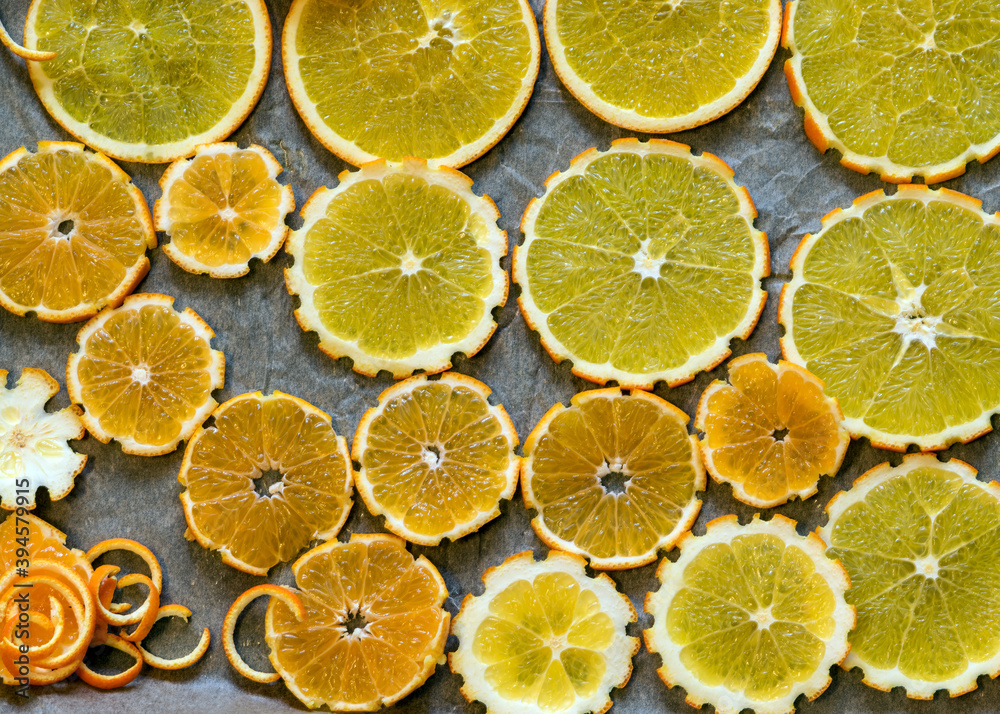 sliced orange slices on a metal pan preparing for drying, preparing for Christmas, waiting for Christmas and home decorating concept sliced orange slices on a metal pan preparing for drying, preparing for Christmas, waiting for Christmas and home decorating concept