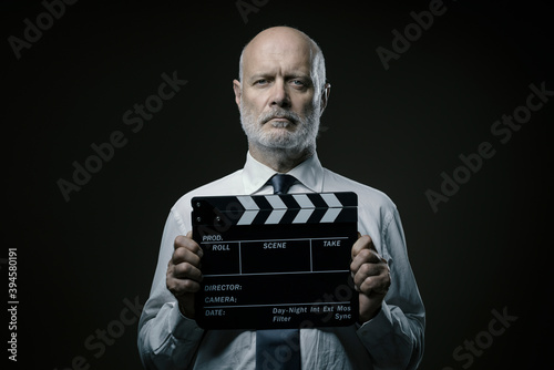 Film director holding a clapperboard