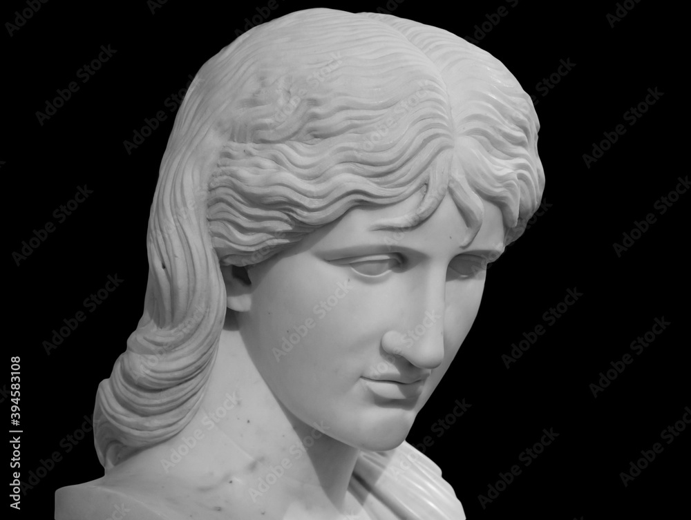 Ancient statue head isolated on black background. Barbarian woman known as Thusnelda. Marble sculpture Ancient statue head isolated on black background. Barbarian woman known as Thusnelda. Marble sculpture