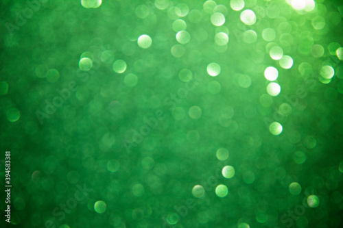 green christmas abstract background with bokeh defocused lights