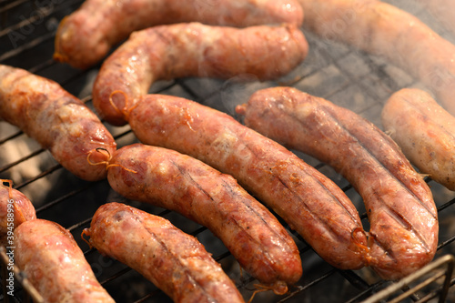 Beautiful fried sausages in a natural shell on the grill