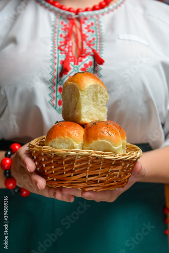 Buns Pampushky - Ukrainian garlic bread. Bread rolls with garlic and parsley. Ethnic concept, Ukrainian cuisine. © zhinna