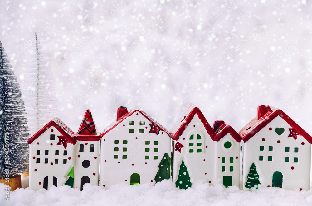 Christmas composition. Christmas trees and a Christmas houses in a snowy forest. Christmas, winter, new year concept.