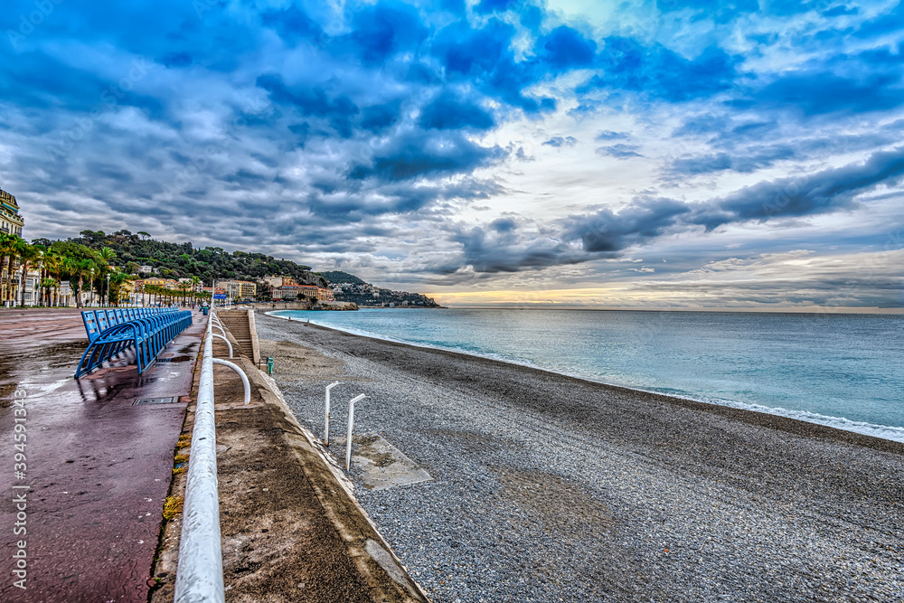 sunrise over the sea and the becah in Nice, France