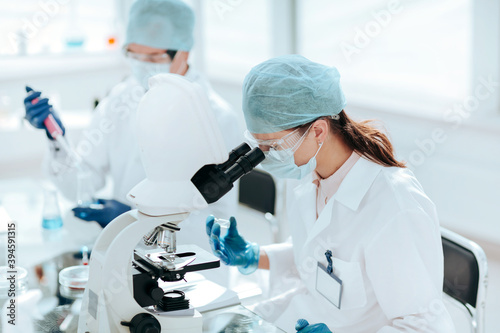 laboratory technician conducts testing in the laboratory .