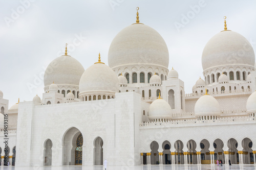 Domes of White Grand Mosque built with white marble stone, also called Sheikh Zayed Grand Mosque, inspired by Persian, Mughal and Moorish mosque architecture