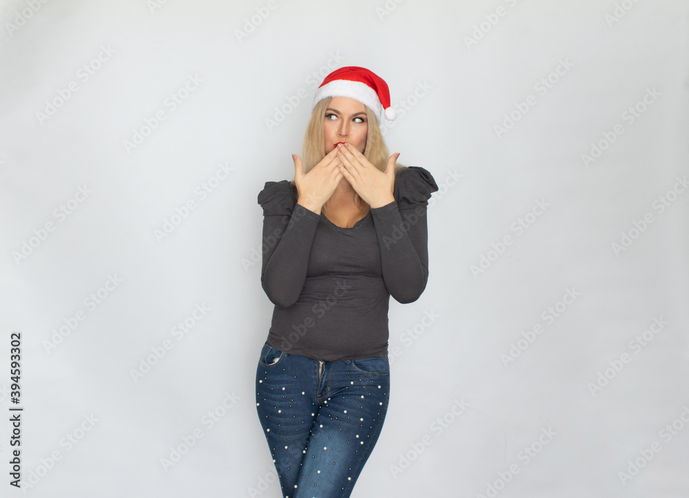 Woman in santa hat posing isolated on white background Woman in santa hat posing isolated on white background