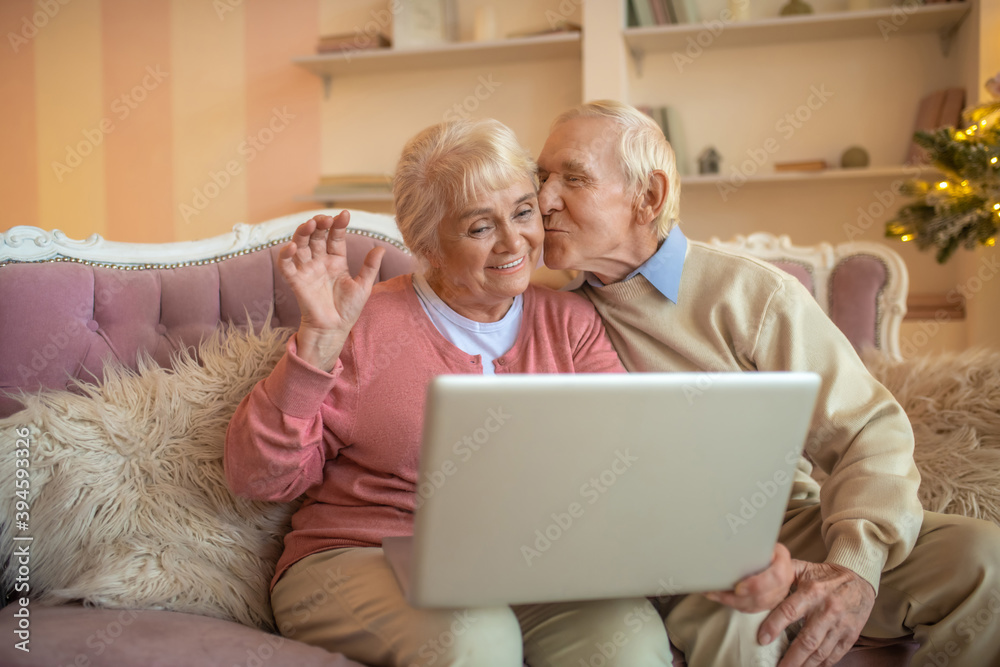 Senior couple having a video call and feeling happy Senior couple having a video call and feeling happy