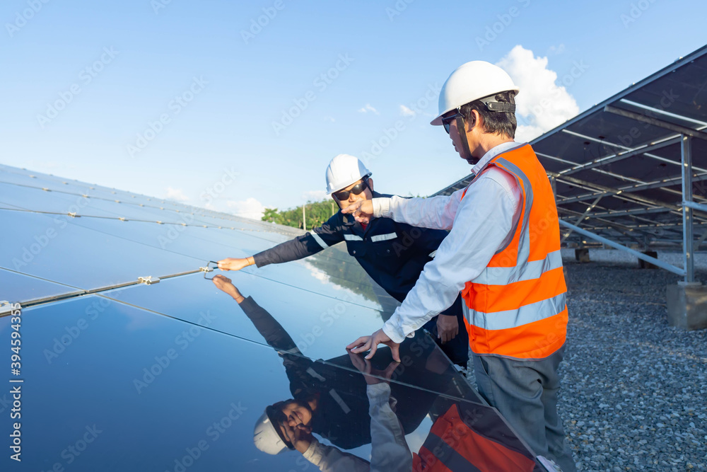 Technicians use the hex screwdriver to fix the hex nut for fixing newly installed solar panels, Alternative energy to conserve the world's energy, Photovoltaic module idea for clean energy production Technicians use the hex screwdriver to fix the hex nut for fixing newly installed solar panels, Alternative energy to conserve the world's energy, Photovoltaic module idea for clean energy production