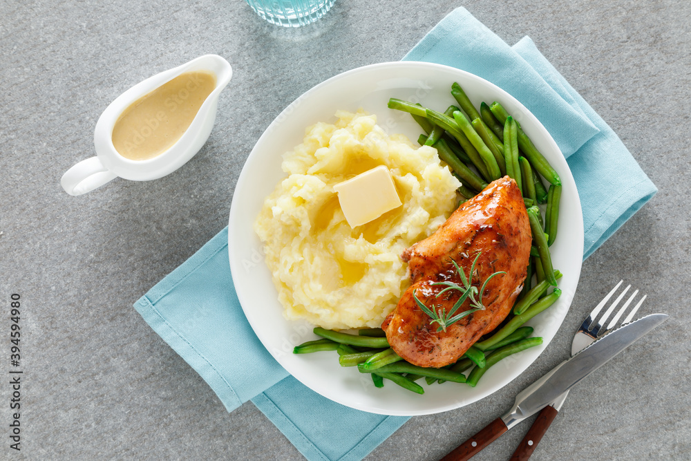 Roasted chicken breast with green beans and boiled mashed potatoes. Dinner or breakfast serving.