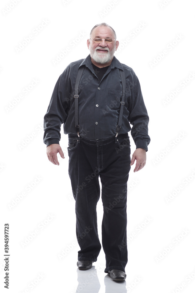 in full growth. happy bearded man striding forward. in full growth. happy bearded man striding forward.