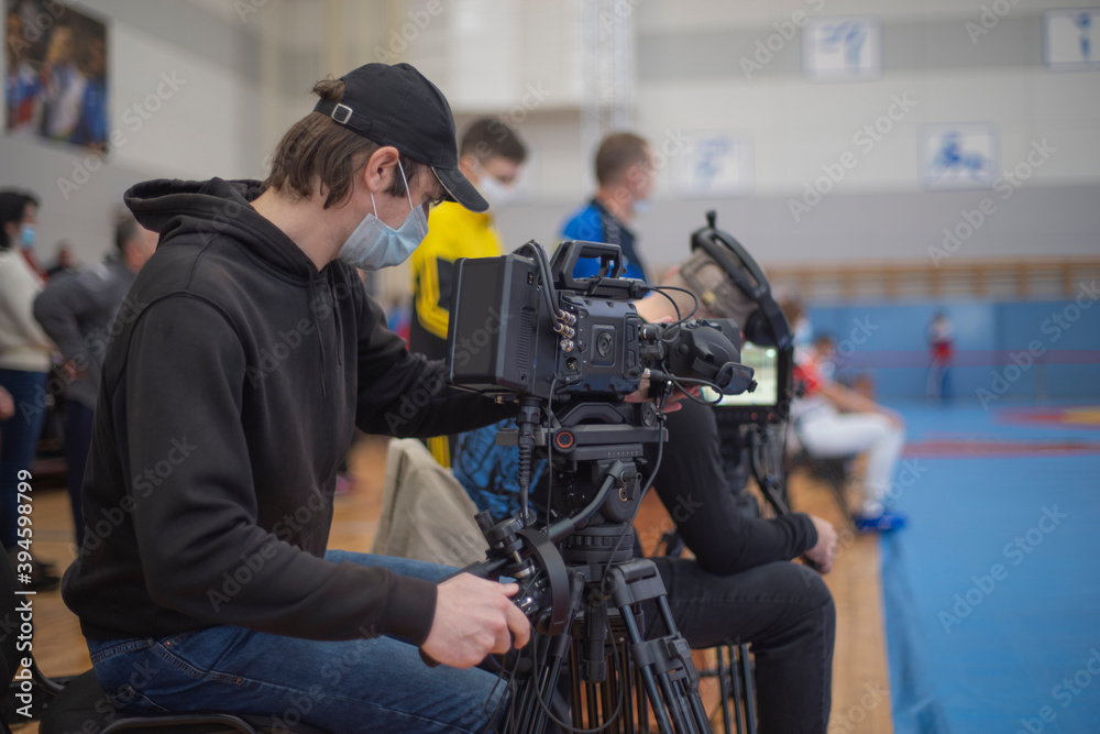 masked operator shoots a stream. Sports event masked operator shoots a stream. Sports event