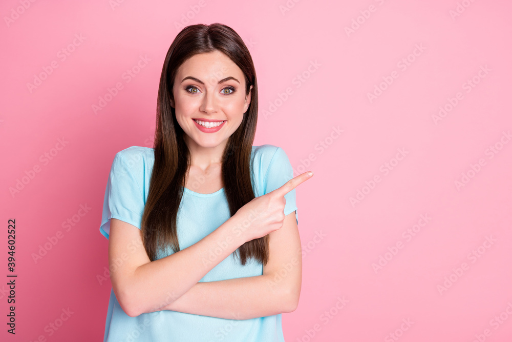 Portrait of positive girl point index finger copyspace isolated over pink color background Portrait of positive girl point index finger copyspace isolated over pink color background