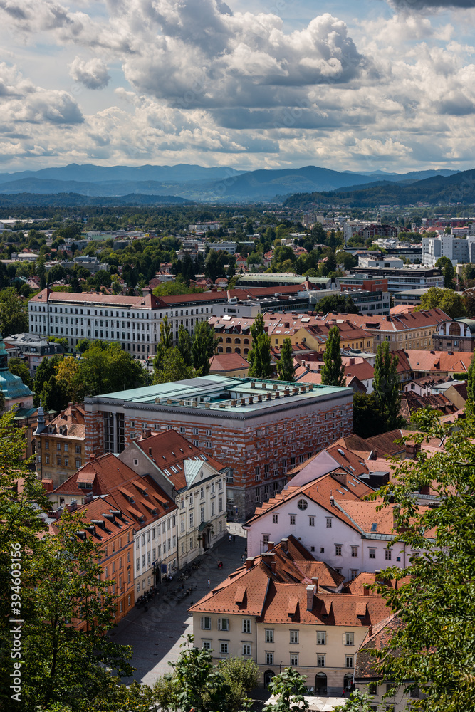 Scenic view from the Ljubljana Castle over the old city center on sunny day in late summer with clouds