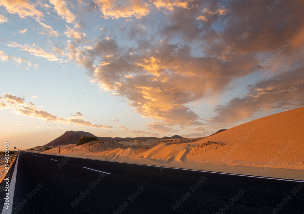 scenic road that runs through the sand dunes of Fuerteventura