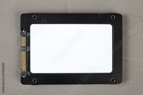 ssd hard drive on a concrete background, close-up, top view.