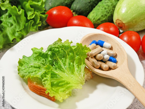 Healthy food vs pills. Vegetables and fruis vs medicine and drugs. photo