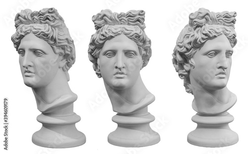 White gypsum copy of ancient statue of Apollo God of Sun head isolated on a white background. Plaster sculpture of man face. Renaissance portrait