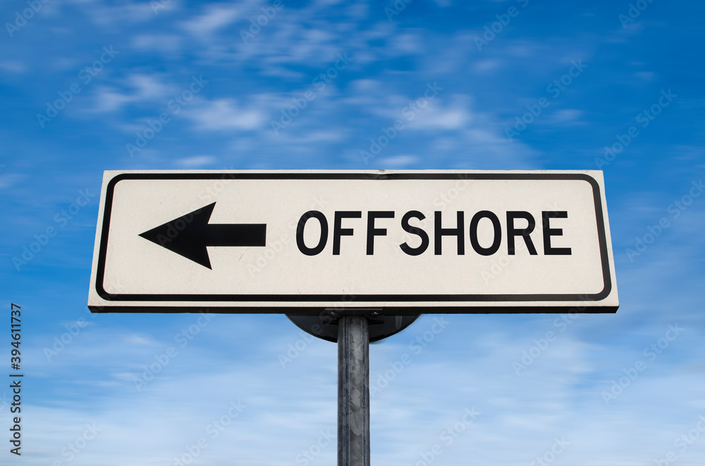 White sign with arrow with offshore. Direction sign. Arrows on a pole pointing in one direction. IT offshoring concept. White sign with arrow with offshore. Direction sign. Arrows on a pole pointing in one direction. IT offshoring concept.