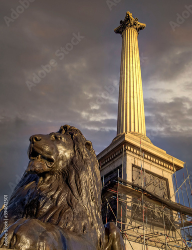 London England, Trafalgar square, Nelson's column and lions statue under dramatic sky