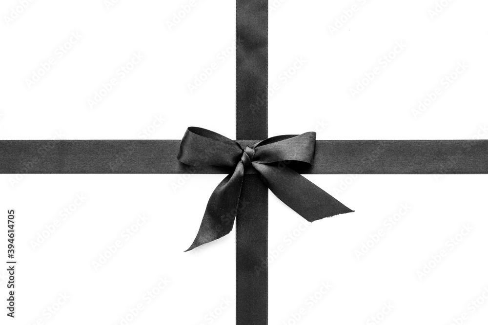 Fototapeta premium Black ribbon with bow isolated on white. Top view, copy space