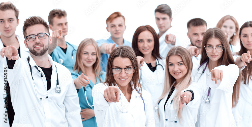 group of diverse medical professionals pointing at you group of diverse medical professionals pointing at you