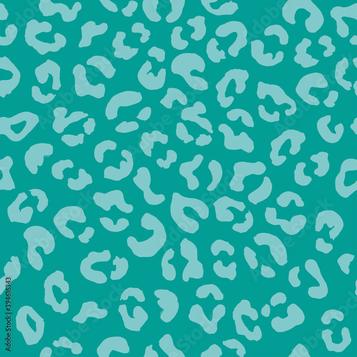 Leopard seamless pattern. Vector animal print. Light blue spots on a turquoise background. Jaguar, leopard, cheetah, panther fur. Leopard skin imitation can be painted on clothes, paper or fabric.