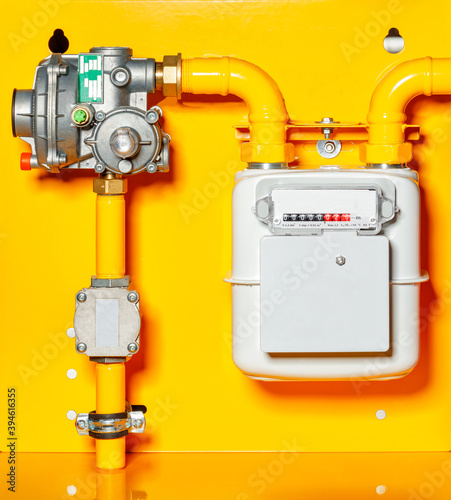 Принти на полотні Gas meter with reducer on a yellow background.